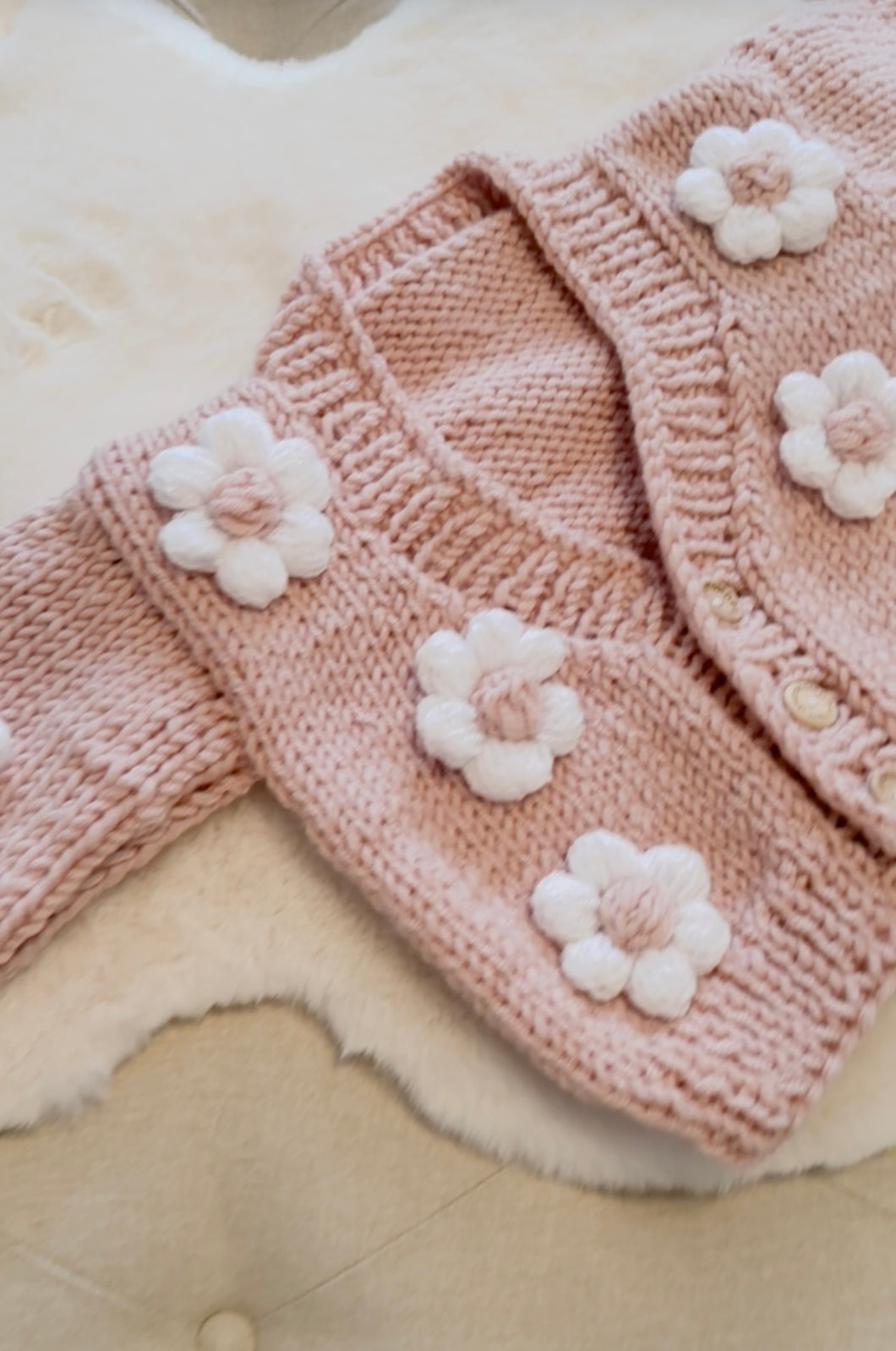 Chunky pink cardigan with white flowers