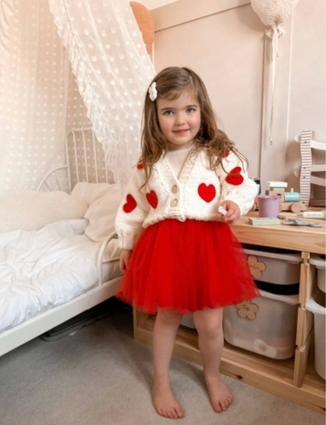 Chunky white cardigan with red hearts