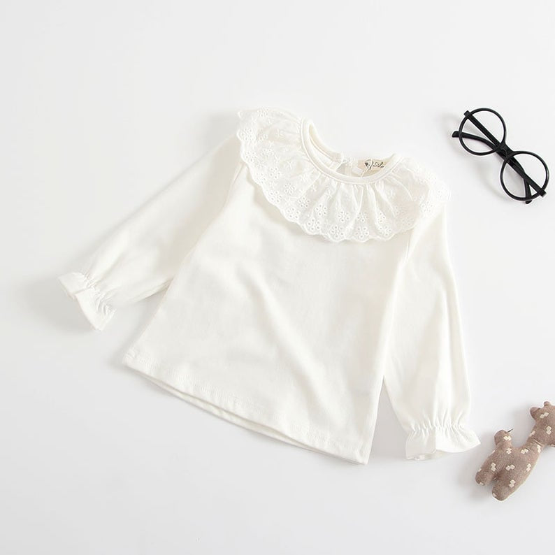 White ruffle blouse